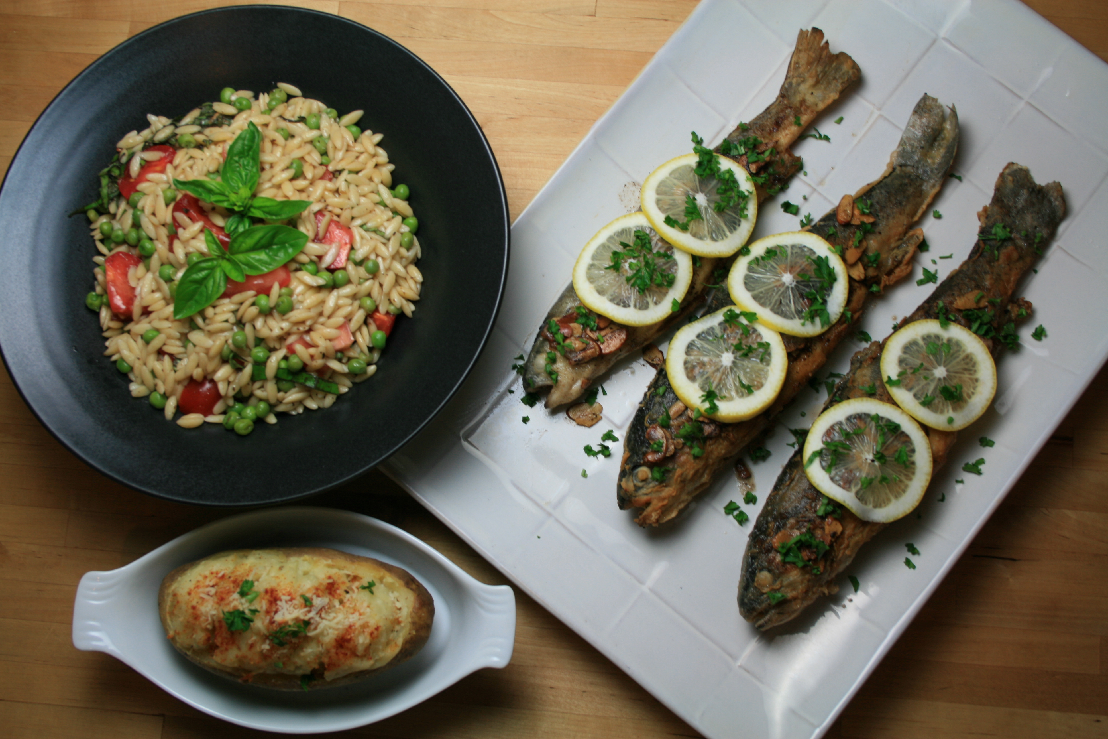 Trout almondine, orzo salad with peas and tomatoes in a balsamic vinaigrette