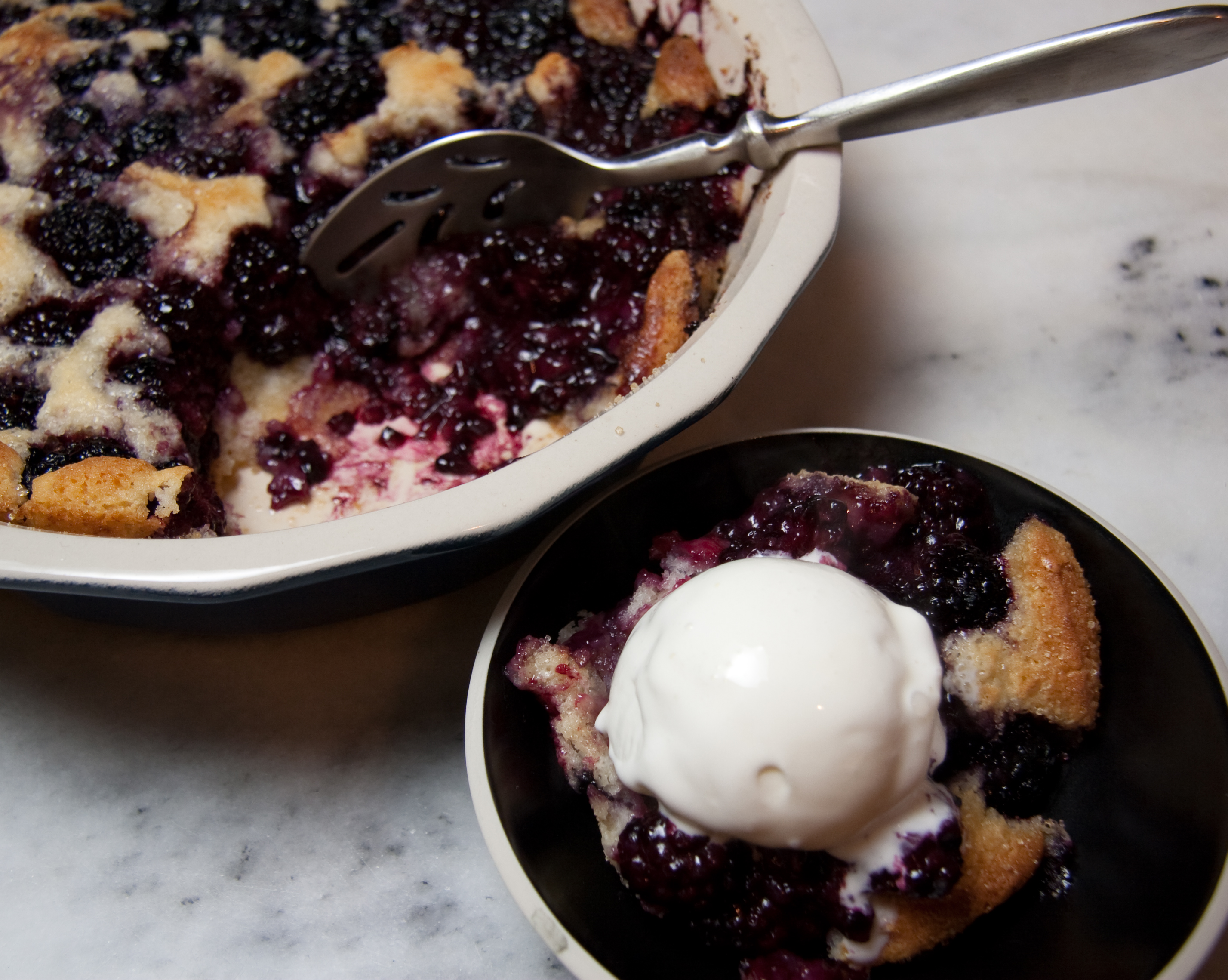 Cobblern Serving Warm Cobbler with Tillamook Vanilla Ice Cream