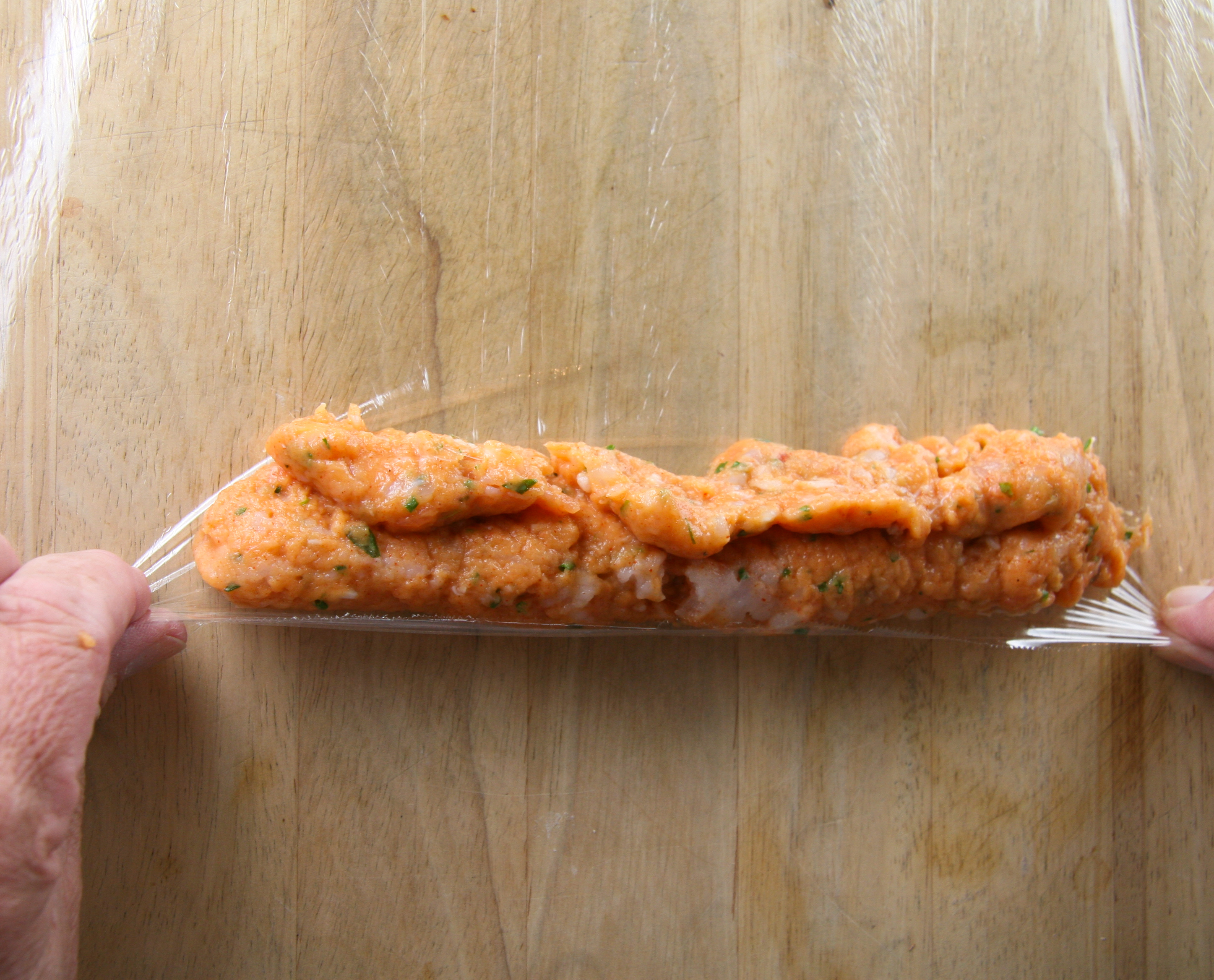 Rolling Sausage Roll the sausage up while pulling gently toward you to keep the mixture tight