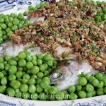 The cooked trout, swimming in a lake of peas heads to the table.